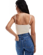 super stretch strappy bodysuit in ecru