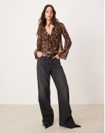 ruffle front shell top in leopard print