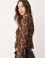 ruffle front shell top in leopard print